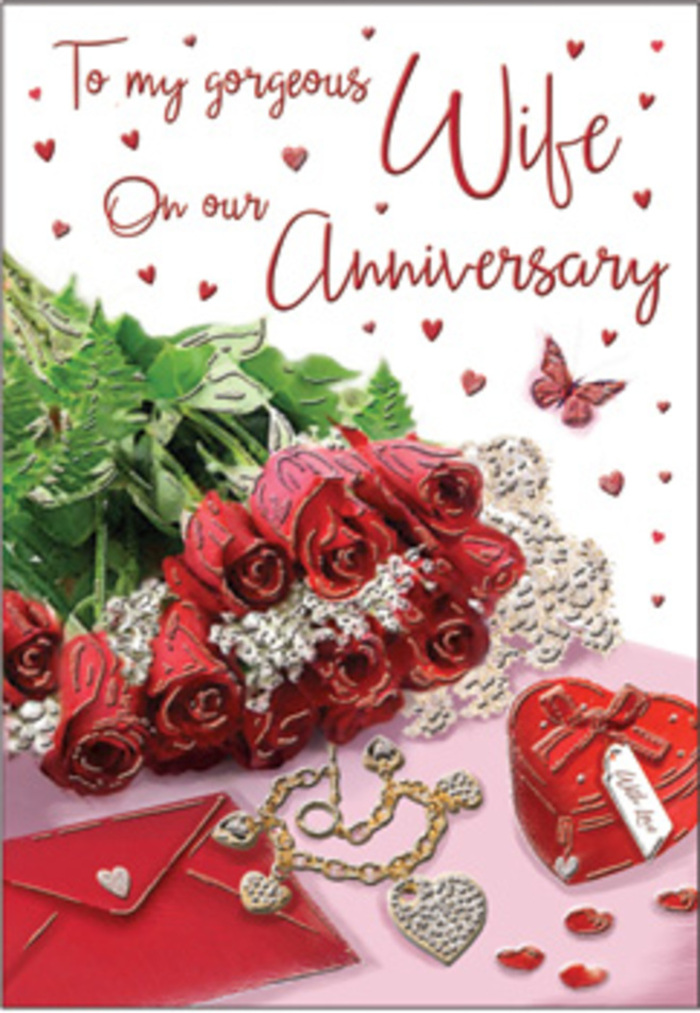 The image unfolds as a rich, emotive anniversary tableau, reminiscent of a carefully prepared surprise waiting on a dining table in Mill Hill before a celebratory meal. At its heart stands a bouquet of classic red roses, each bloom luxuriously full, the petals layered in generous curves that convey both strength and softness. The roses are elegantly wrapped and interwoven with lush green foliage, whose deep tones make the scarlet petals appear even more vivid. Around the central bouquet sit layers of delicate detail: whisper-thin lace, soft heart motifs, and the subtle sheen of ribbon, all orchestrated to guide the gaze gently around the scene. A jewellery set, perhaps a necklace and earrings, is displayed like a treasured keepsake, while a vivid red box rests nearby, its clean lines and rich colour suggesting a meaningful gift chosen with care. The scripted message on the card is visible but not overpowering, written in flowing, romantic lettering that feels timeless. Textures of velvet, gold, and silk thread through the composition, from the imagined softness of the rose petals to the cool touch of metal and the smooth surface of polished packaging. The lighting is warm and diffused, reminiscent of late afternoon sunlight filtering through a Mill Hill window, wrapping everything in a comforting glow. The overall atmosphere is deeply romantic and reassuring, evoking the warmth of a long embrace shared after years together. This design feels like a visual echo of vows renewed and quiet toasts raised at home, perfect for couples in Mill Hill who value both elegance and heartfelt sentiment on their anniversary.