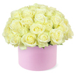 A romantic rose hat box is shown in full view, its design combining modern presentation with classic floral elegance. The container is a round, pastel pink box with a velvety matte look, sturdy yet understated, like the type of gift packaging often chosen for special deliveries to homes and businesses around Mill Hill. Emerging from the rim is a lush, domed mass of roses arranged so densely that they form a continuous surface of petals, with only a few discreet glimpses of green foliage at the base. The roses are predominantly cream and pale ivory, some with a soft wash of pastel yellow nestled deep in the centres, creating gentle highlights that give the bouquet visual depth. Each bloom is captured at an open or nearly open stage, with layered petals curving outward in soft spirals, lending the arrangement a welcoming, almost embracing feel. The careful shaping of the dome suggests professional craftsmanship, each stem placed at just the right angle to build a rounded silhouette that slightly overflows the lip of the box. Set against a fresh white background, the blush tones of the box and the neutral roses are clearly defined and unhurried, inviting the viewer to imagine the texture and faint perfume of the flowers. This arrangement could easily be pictured as an anniversary surprise or refined thank-you gift, delivered by a Mill Hill florist to a townhouse near the Ridgeway or a cosy apartment off Mill Hill Broadway. The image captures the quiet joy of receiving a thoughtfully curated rose box, full of tenderness, grace, and a sense of occasion.