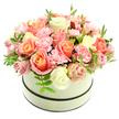 A plush, domed floral composition sits inside a round, cream-coloured hatbox, photographed against a pure white background so every petal and shadow reads clearly. The box has a soft matte finish and two thin dark bands - one tracing the rim and one near the base - that give the understated vessel a neat, modern edge while letting the flowers remain the focal point. Tightly packed and overflowing, the bouquet is a study in gentle warmth: large velvety roses in shades that move from coral-peach and apricot at their hearts to pale blush pink and ivory at their outer petals, each bloom at a different stage of opening so the surface feels alive with texture. Nestled between those larger blooms are clusters of ruffled light-pink carnations whose frilly edges add a soft, tactile contrast to the smooth rose petals. Sparse sprigs of fresh bright-green foliage with narrow leaves peep through the blossoms, offering refreshing breaks of colour and a hint of garden-fresh scent. The lighting is soft and even, catching the subtle sheen on petals and suggesting a quiet morning or late-afternoon glow, while the overall arrangement reads as elegant and heartfelt - a luxurious gift for birthdays, anniversaries, Mother's Day or a thoughtful congratulations. The design feels handcrafted by an experienced florist's hand: balanced, dense, and tender, inviting the recipient to lean in, breathe the faint powdery sweetness, and linger on the craftsmanship that made this composition feel at once classic and intimate.