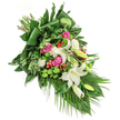 This heartfelt funeral spray offers a mosaic of the most tender blooms, reflecting the tranquil charm of Mill Hill. The design begins with creamy white lilies-some in full, fragrant bloom, others poised in softened bud-bringing an air of peace and solace to the arrangement's diagonal flow. Deep pink roses subtly emerge, their petals opening in gradients of rosy warmth, symbolising cherished memories and remembrance. Soft, ruffled white spray carnations nestle amongst the primary blossoms, adding both fullness and gentle contrast to the overall composition. Pops of bright green from spherical santini chrysanthemums create a lively, textural accent, while shiny red hypericum berries punctuate the greenery with cheer and natural vitality. The foundation is a tapestry of diverse foliage-broad, glossy leaves frame the edges, while slender palm fronds and fine, feathery greens cascade gracefully, forming a lush yet elegant finish. Inspired by the area's peaceful parks and leafy lanes, this arrangement feels like a quiet embrace, crafted with empathy by Mill Hill florists for memorial services or as a gentle condolence. Radiating comfort and beauty, each element carries the skill and sincerity of those who know the unique needs of the local community.