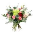 A hand-tied bouquet photographed against a clean, brilliant white background, arranged to celebrate texture, colour and a quietly confident romantic mood. At its centre sits a voluminous cluster of lime-green hydrangea, the tiny, cloud-like petals catching light and forming a soft, sculptural focal point. Surrounding that green heart are several roses in deep, velvety red and more tender blush pink and cream tones; the red roses read as classic and passionate while the paler roses breathe a gentle, romantic softness. Scattered through the composition are coral-pink carnations with their ruffled, frilly edges, adding lively warmth and a plush, tactile contrast to the smooth rose petals. The bouquet is given an unexpected, architectural edge by blue-grey Eryngium thistles - spiky, star-shaped sea holly that introduces a cool, steely note against the warmer florals. A generous sweep of silvery eucalyptus leaves provides a muted, aromatic backdrop, their round shapes and dusty sheen balancing the sharper thistles. Long, bright-green grass blades and slim filler stems extend upward and outward, lending lightness and a sense of movement as if the bouquet has just been gathered in a breezy Mill Hill garden. The stems are neatly gathered and bound with natural twine at the base, revealing freshly cut green stalks and the careful hand-tied craftsmanship of a local florist. In soft daylight this arrangement reads as joyful and refined - suitable for anniversaries, birthdays, a Mother's Day token, or simply to bring calm colour into a contemporary home in and around Mill Hill Village.
