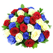 A richly textured bouquet of red, white, and cobalt blue roses is arranged in a compact, dome-like shape, creating a powerful visual impact against a stark white studio background. Around three dozen roses, all in full bloom, are packed closely together so that their velvety petals form a continuous landscape of colour, with gentle curves and layered spirals drawing the eye across the arrangement. The deep reds bring warmth and intensity, the whites glow with a clean, luminous quality, and the blues add an unexpected, contemporary note, together forming a distinctly patriotic palette that feels at home in Mill Hill during national celebrations and commemorative moments. Interspersed within the dome, dark green foliage slips between the blossoms, offering subtle contrast and helping to separate one rose from the next, while also enhancing the bouquet's neatly rounded outline. Bright, even lighting washes over the flowers, revealing every nuance of texture-from the soft, almost suede-like petals to the smooth sheen of the leaves-emphasising how fresh and carefully arranged the bouquet appears, as though it has just left a Mill Hill florist's workbench for delivery in NW7. There is no visible container or decorative wrapping, so the focus remains solely on the interplay of colour and the craftsmanship behind the design. The mood it conveys is one of respect, remembrance, and hopeful celebration, making this arrangement ideal for patriotic events, services of thanks, or as a meaningful gift to honour someone special in the Mill Hill community.